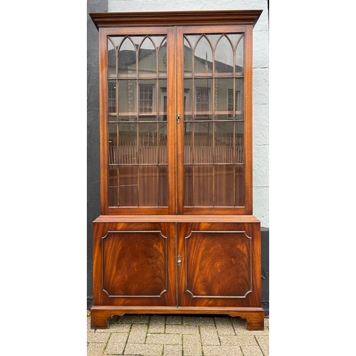 109 - A VERY GOOD QUALITY PAIR OF FLAME MAHOGANY GLAZED LIBRARY BOOKCASES, each with a pair of gothic styl... 