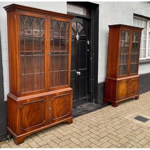 109 - A VERY GOOD QUALITY PAIR OF FLAME MAHOGANY GLAZED LIBRARY BOOKCASES, each with a pair of gothic styl... 