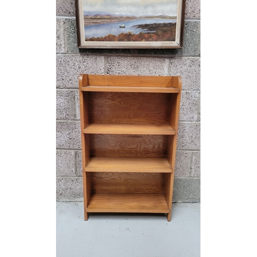 111 - A GOOD TEAK MID-CENTURY OPEN FLOOR BOOKCASE, with raised three-quarter gallery to the top. Possibly ... 