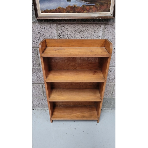 111 - A GOOD TEAK MID-CENTURY OPEN FLOOR BOOKCASE, with raised three-quarter gallery to the top. Possibly ... 