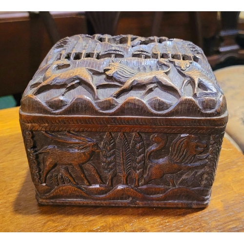 116 - A BEAUTIFUL HAND CARVED HINGED WOODEN HUMIDOR BOX, the exterior decorated with intricate carved deta... 