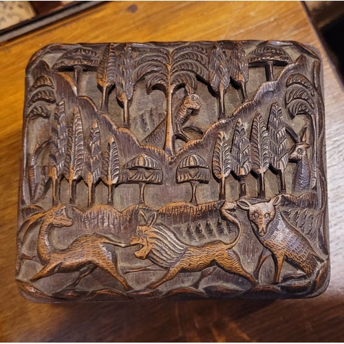 116 - A BEAUTIFUL HAND CARVED HINGED WOODEN HUMIDOR BOX, the exterior decorated with intricate carved deta... 