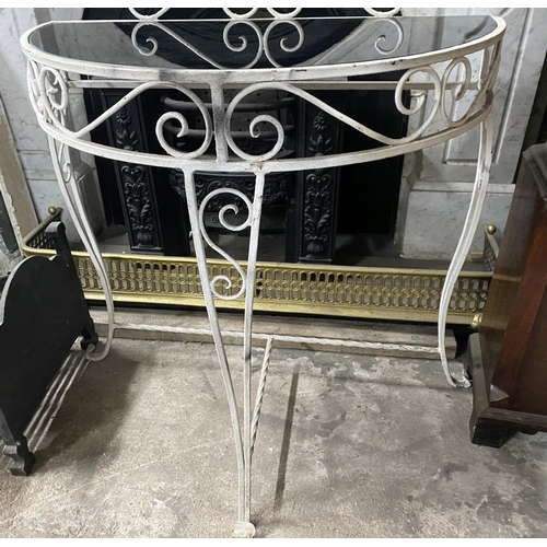 122 - A MID CENTURY WROUGHT IRON DEMI-LUNE CONSOLE TABLE, the reverse painted glass top with raised scroll... 