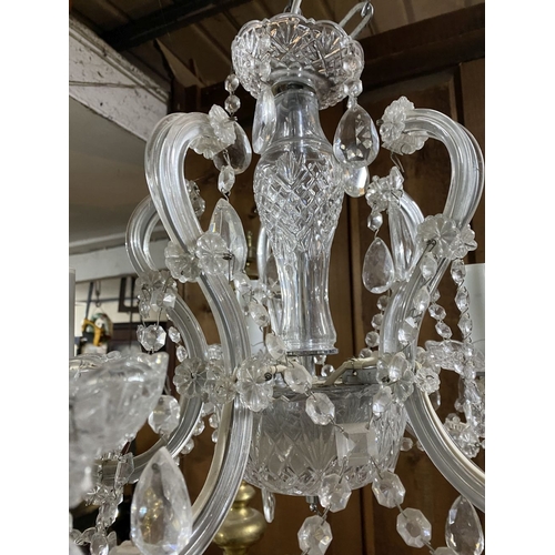 123 - A BEAUTIFUL CRYSTAL FIVE BRANCH CHANDELIER, with cut glass support, five scrolling branches with cut... 