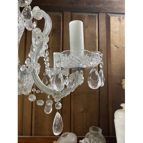 123 - A BEAUTIFUL CRYSTAL FIVE BRANCH CHANDELIER, with cut glass support, five scrolling branches with cut... 