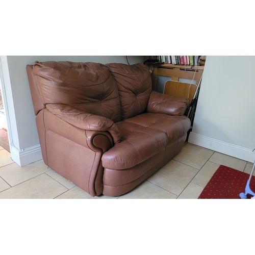 127 - A GOOD TWO SEATER TAN LEATHER COUCH, with padded back & arm rests. In fair condition; ware commensur... 