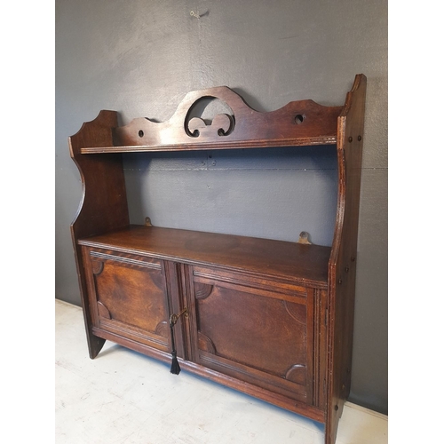 136 - A GOOD ANTIQUE WALL CUPBOARD, with working lock & key. The top with open shelf raised on a pair of s... 