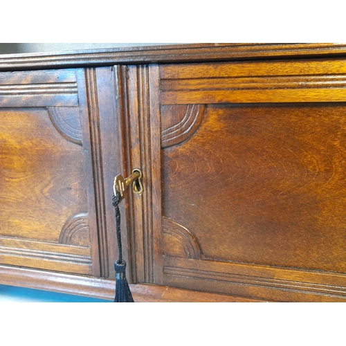 136 - A GOOD ANTIQUE WALL CUPBOARD, with working lock & key. The top with open shelf raised on a pair of s... 