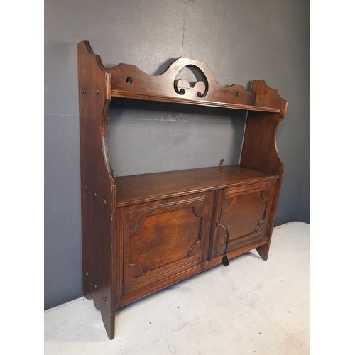 136 - A GOOD ANTIQUE WALL CUPBOARD, with working lock & key. The top with open shelf raised on a pair of s... 