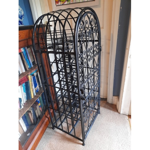 137 - A VERY GOOD, HEAVY, SPANISH STYLE WROUGHT IRON FLOOR STNADING WINE CAGE, lockable, holds 24 bottles.... 