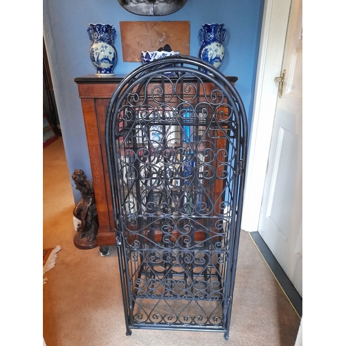 137 - A VERY GOOD, HEAVY, SPANISH STYLE WROUGHT IRON FLOOR STNADING WINE CAGE, lockable, holds 24 bottles.... 