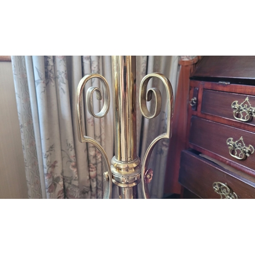 17 - A VERY GOOD QUALITY WROUGHT BRASS STANDARD LAMP, with scrolling supports dotted with copper coloured... 