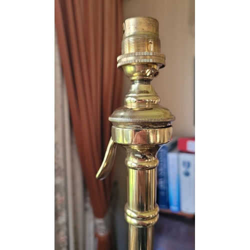 17 - A VERY GOOD QUALITY WROUGHT BRASS STANDARD LAMP, with scrolling supports dotted with copper coloured... 