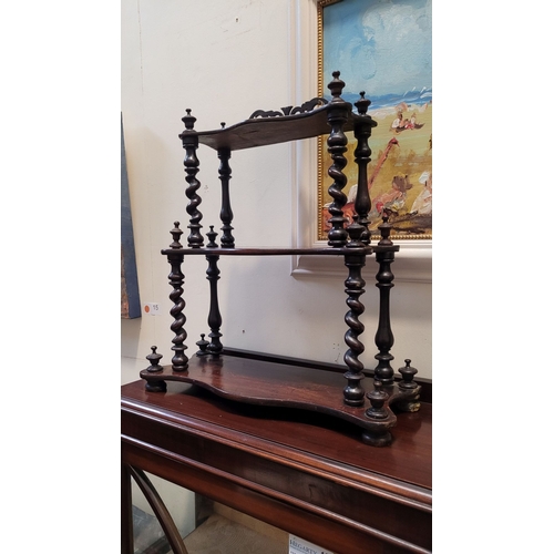 173 - A NEAT LATE 19TH CENTURY THREE TIER TABLE TOP WHAT-NOT SHELF, the serpentine shelves raised with tur... 