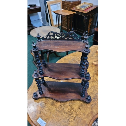 173 - A NEAT LATE 19TH CENTURY THREE TIER TABLE TOP WHAT-NOT SHELF, the serpentine shelves raised with tur... 