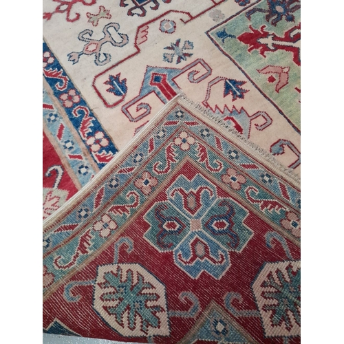 175 - AN EXCELLENT HAND-KNOTTED KAZAK RUG, hand-woven, featuring tradition Kazak pattern with multiple geo... 