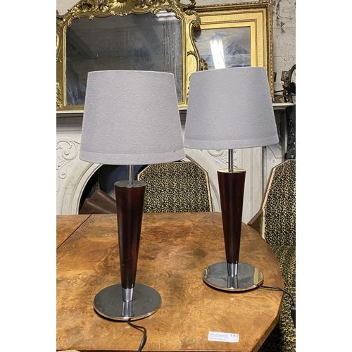 179 - A PAIR OF CHROME AND ROSEWOOD STYLE TABLE LAMPS, with tapered support atop circular base. Dimensions... 