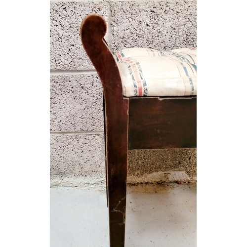 189 - AN ANTIQUE PIANO STOOL, with padded button topped lift away seat, on each side turned elbow rest han... 