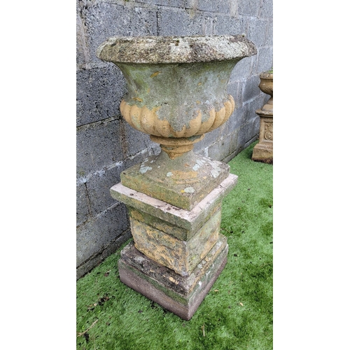 195 - A LARGE OLD GARDEN URN PLANTER ON A RAISED PEDISTAL, with fluted detail to the urn, old paint in pla... 