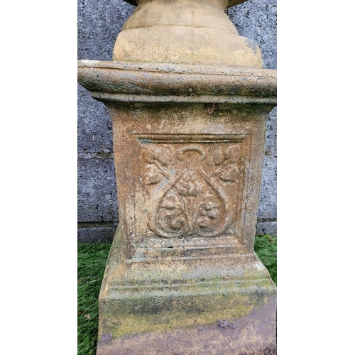 196 - A PAIR OF OLD GARDEN URNS ON PEDESTAL BASES, the urn planters with eagle head detail & petal gadroon... 