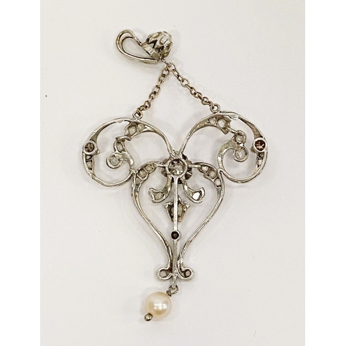 20 - A VERY FINE BELLE EPOQUE DIAMOND AND PEARL PENDANT, of ribbon bow and garland design, the raised cen... 