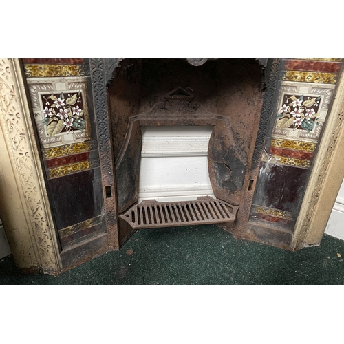 202 - A DECORATIVE ANTIQUE CAST IRON FIRE SURROUND/FIREPLACE INSERT, with original hand glazed coloured fl... 