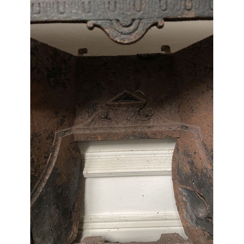 202 - A DECORATIVE ANTIQUE CAST IRON FIRE SURROUND/FIREPLACE INSERT, with original hand glazed coloured fl... 