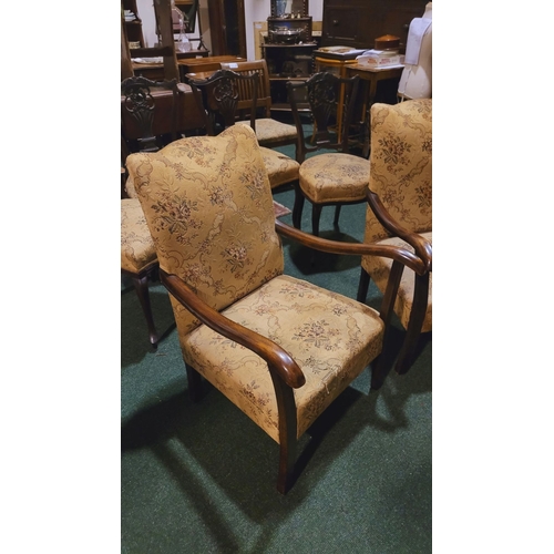 208 - A PAIR OF EARLY 20TH CENTURY LOW RISE ARM CHAIRS, each with camel shaped back rest & a pair of scrol... 