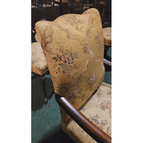 208 - A PAIR OF EARLY 20TH CENTURY LOW RISE ARM CHAIRS, each with camel shaped back rest & a pair of scrol... 