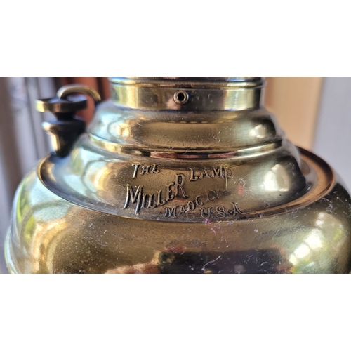 213 - AN AMERICAN MILLER OIL LAMP, with ceramic base, a beautiful piece of brass craftsmanship. Dimensions... 