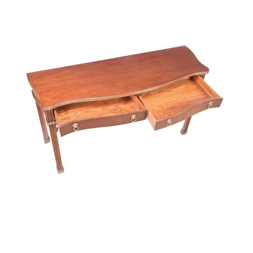 217 - A VERY FINE MAHOGANY SERPENTINE SHAPED CONSOLE / HALL TABLE, a lovely table with reed trim to the ta... 