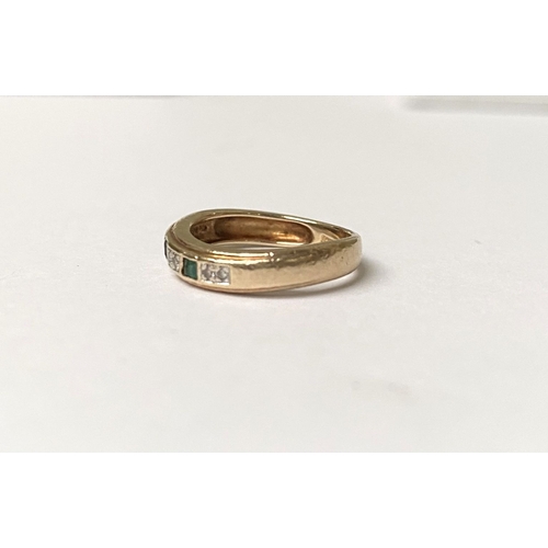 227 - A DAINTY 9CT YELLOW GOLD EMERALD AND DIAMOND BAND RING, with three princess cut emeralds, each separ... 