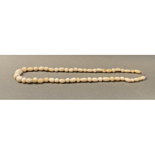 232 - TWO GRADUATED CARVED BONE NECKLACES ALONG WITH TWO HIGHLY CARVED BONE NECKLACES, the graduated pair ... 