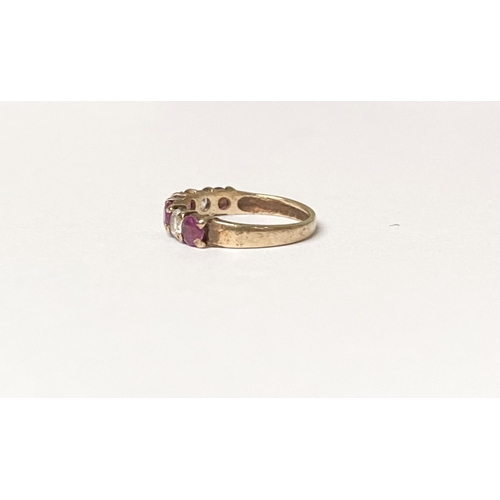 236 - A BEAUTIFUL HALF ETERNITY GEMSET BAND RING, with four round cut red gemstones separated by three rou... 