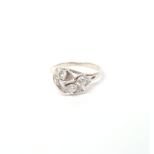 24 - A BEAUTIFUL MID-CENTURY 14CT WHITE GOLD DIAMOND RING, the stones set in beautifully crafted lily flo... 