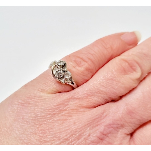 24 - A BEAUTIFUL MID-CENTURY 14CT WHITE GOLD DIAMOND RING, the stones set in beautifully crafted lily flo... 