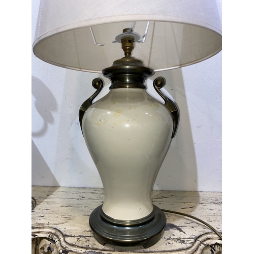 240 - A GOOD VINTAGE URN TABLE LAMP, with scroll handles to sides, body of bulbous form and circular platf... 