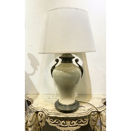 240 - A GOOD VINTAGE URN TABLE LAMP, with scroll handles to sides, body of bulbous form and circular platf... 