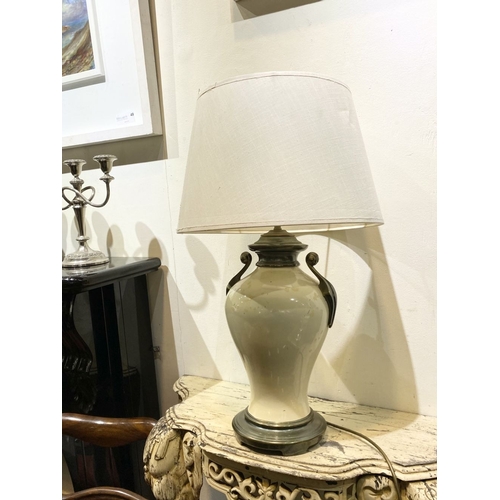 240 - A GOOD VINTAGE URN TABLE LAMP, with scroll handles to sides, body of bulbous form and circular platf... 