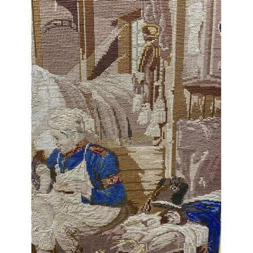 242 - A CHARMING VINTAGE FRAMED WOOLWORK TAPESTRY, depicting a rural scene with mother, child, horses, a d... 