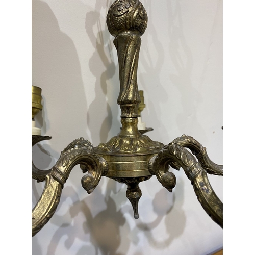 243 - A VINTAGE SOLD BRASS FIVE BRANCH CHANDELIER, with decorative support and foliate decoration to five ... 