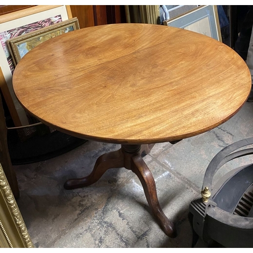 244 - A 19TH CENTURY MAHOGANY TIP UP TABLE, circular top on turned support atop tripod base with cabriole ... 