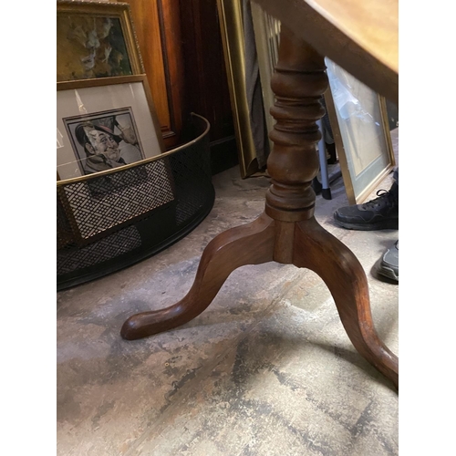 244 - A 19TH CENTURY MAHOGANY TIP UP TABLE, circular top on turned support atop tripod base with cabriole ... 