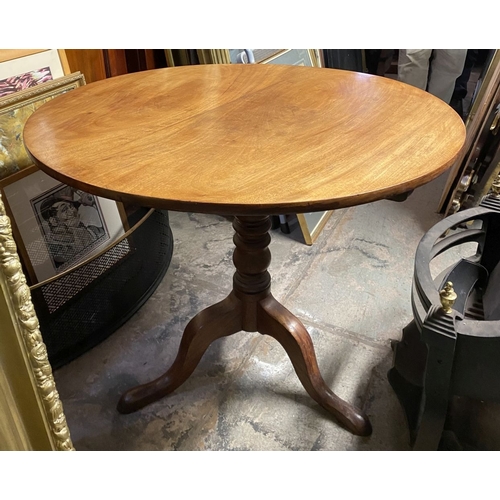 244 - A 19TH CENTURY MAHOGANY TIP UP TABLE, circular top on turned support atop tripod base with cabriole ... 