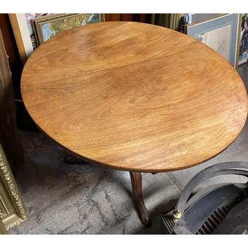 244 - A 19TH CENTURY MAHOGANY TIP UP TABLE, circular top on turned support atop tripod base with cabriole ... 