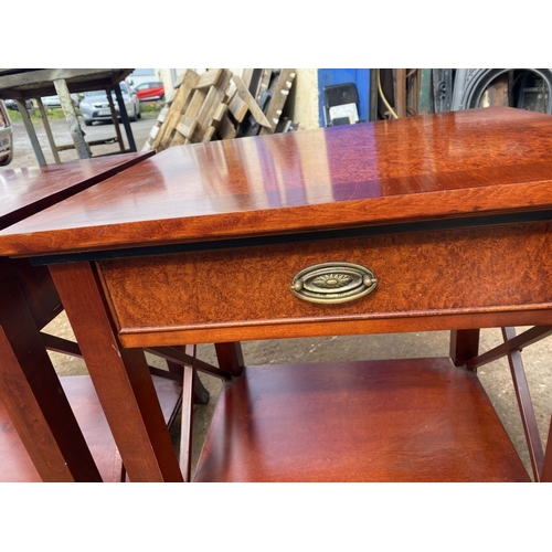 245 - A PAIR OF IRISH MADE SINGLE DRAWER SIDE TABLE / LAMP TABLES, with an ‘x’ shaped support to the sides... 