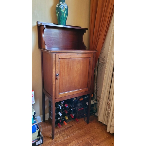 25 - A GOOD QUALITY EARLY 20TH CENTURY TALL CABINET, with a high gallery back having a single shelf raise... 