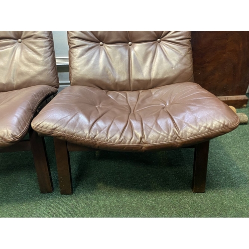 251 - A GOOD PAIR OF SCANDINAVIAN STYLE LOUNGE ARMCHAIRS, with removable button backed leather seats, the ... 