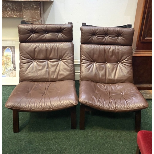 251 - A GOOD PAIR OF SCANDINAVIAN STYLE LOUNGE ARMCHAIRS, with removable button backed leather seats, the ... 