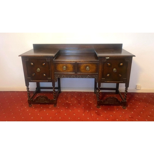 253 - A GOOD BREAKFRONT SIDEBOARD, with gallery to back, one drawer to centre flanked by two panelled door... 